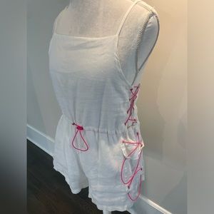 White linen romper with neon pink drawstrings